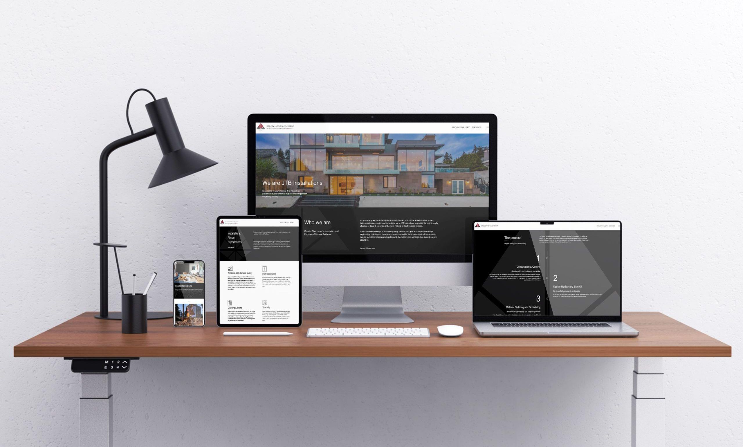 Mockups of JTB Installations' website displayed on multiple devices.